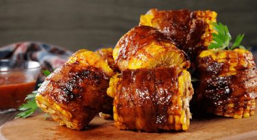 cajun bacon wrapped corn from pellet grill