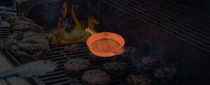 cast iron iron with burgers in the background